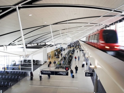 a tram passing through an airport
